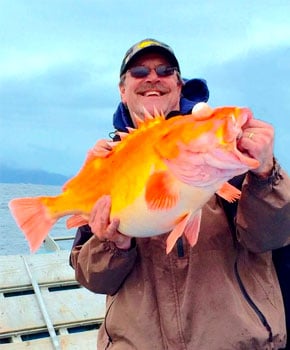Jim Hunt showing his yellow eye fish catch