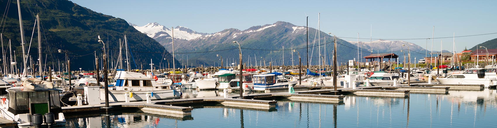 The Whittier Harbor with Alaskan mountains in the background.