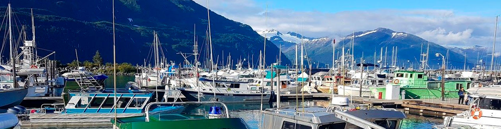 Whittier Harbor photo with a mountains in the background